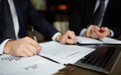 businessman-reading-contract-closeup