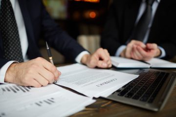 businessman-reading-contract-closeup