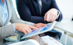 close-up-businesswoman-pointing-digital-tablet