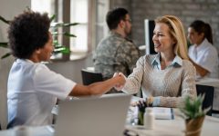 happy-woman-african-american-female-doctor-shaking-hands-after-medical-appointment-clinic
