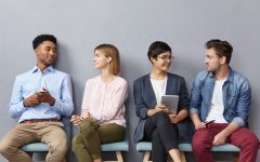 horizontal-portrait-of-people-sit-in-queue-have-pleasant-conversation-with-each-other