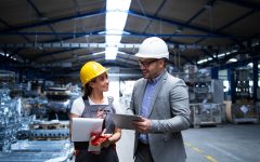 manager-supervisor-and-worker-discussing-about-production-results-and-new-strategy-in-factory-industrial-hall