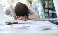 tired-overworked-businessman-sleeping
