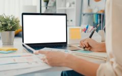 young-asia-businesswoman-use-smart-phone-with-blank-white-screen-while-smart-working-from-home-living-room